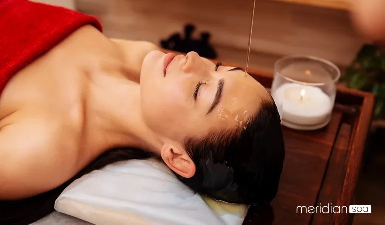 Scalp massage with essential oils